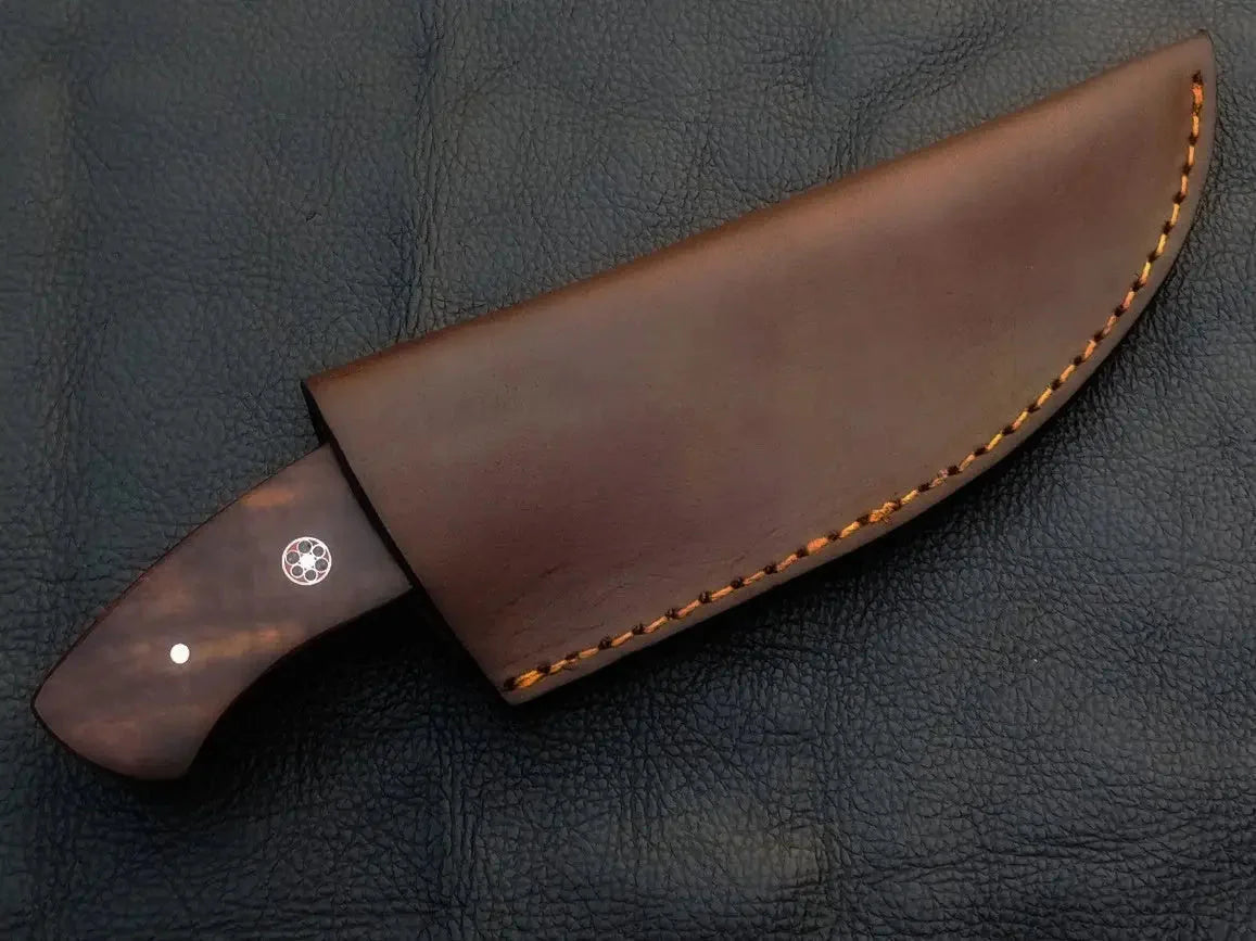 Damascus steel hunting knife with brown leather sheath.
