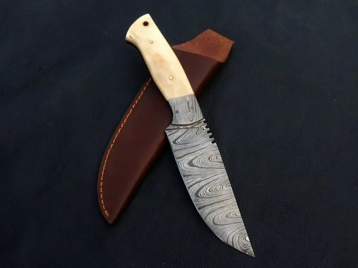 Handmade Damascus steel hunting knife with leather sheath.