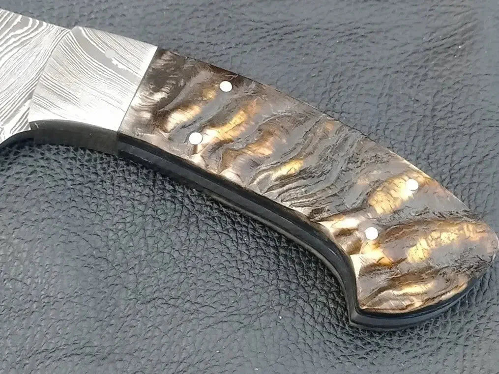 Damascus Steel Knife-C102 with metal handle on black surface
