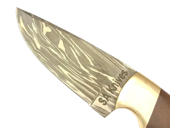 Handmade Damascus Steel Hunting Knife on Table