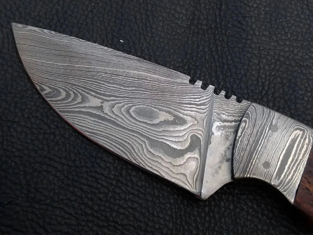 Handmade Damascus Steel Skinning Knife-C3 with wooden handle on black background.