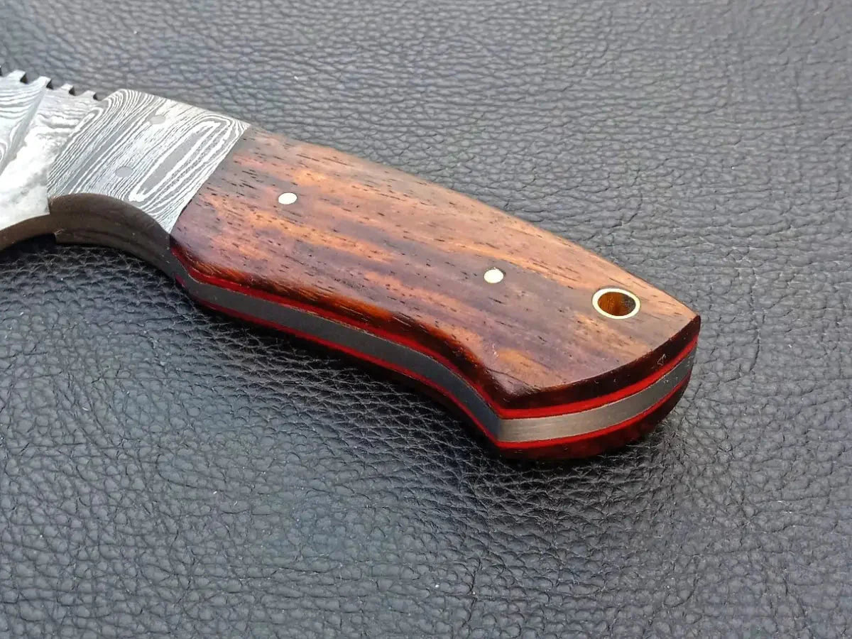 Handmade Damascus Steel Skinning Knife-C3 on black surface